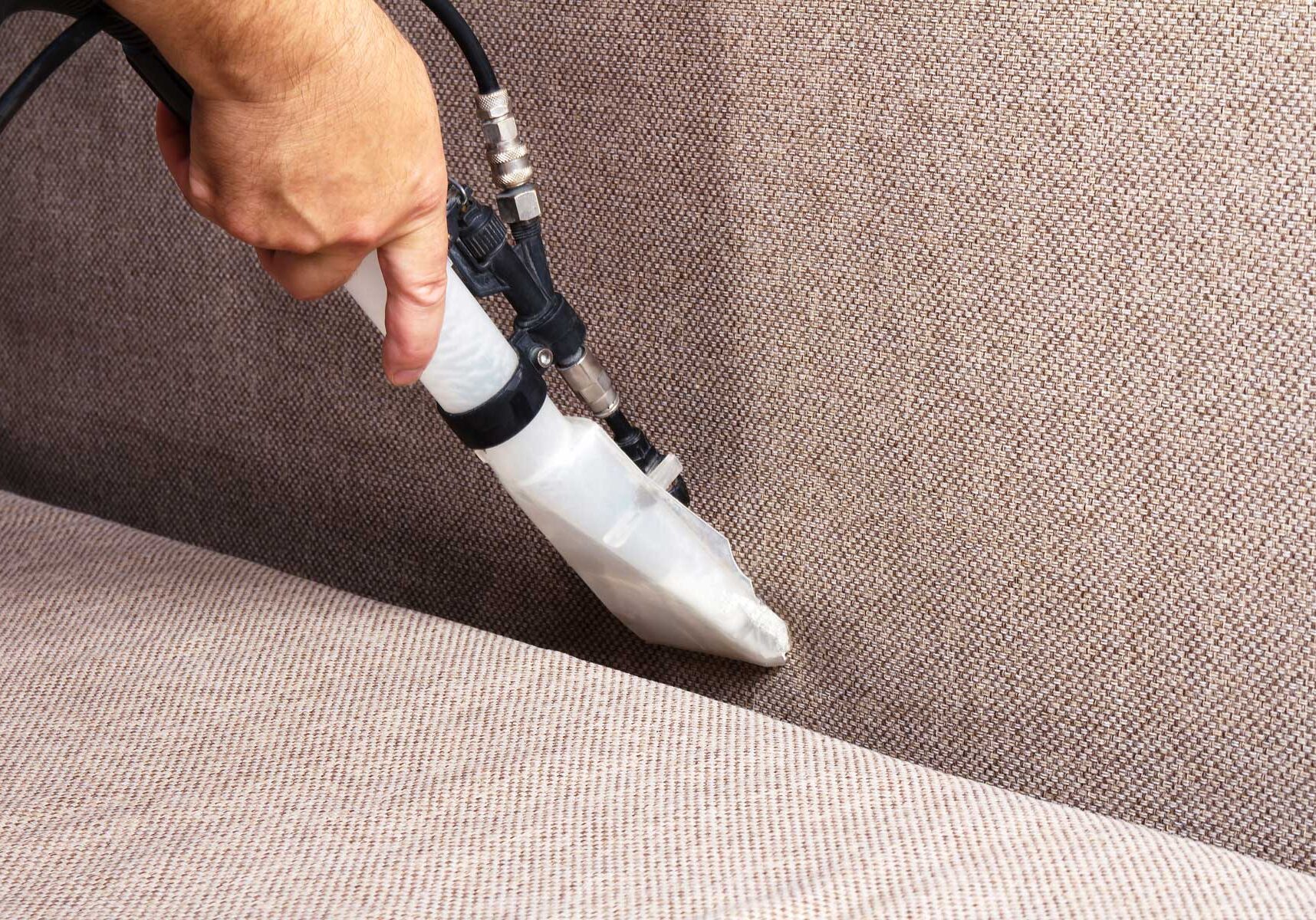 Cleaning sofas. Professional cleaning of the upholstery on a sofa